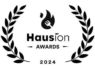 Logo for the Hausion Awards 2024. The design features a stylized flame icon above the word "Haution" and the text "AWARDS" beneath it. The year "2024" is displayed at the bottom. - Hausion